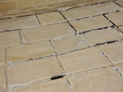 Before regrouting - damaged grout